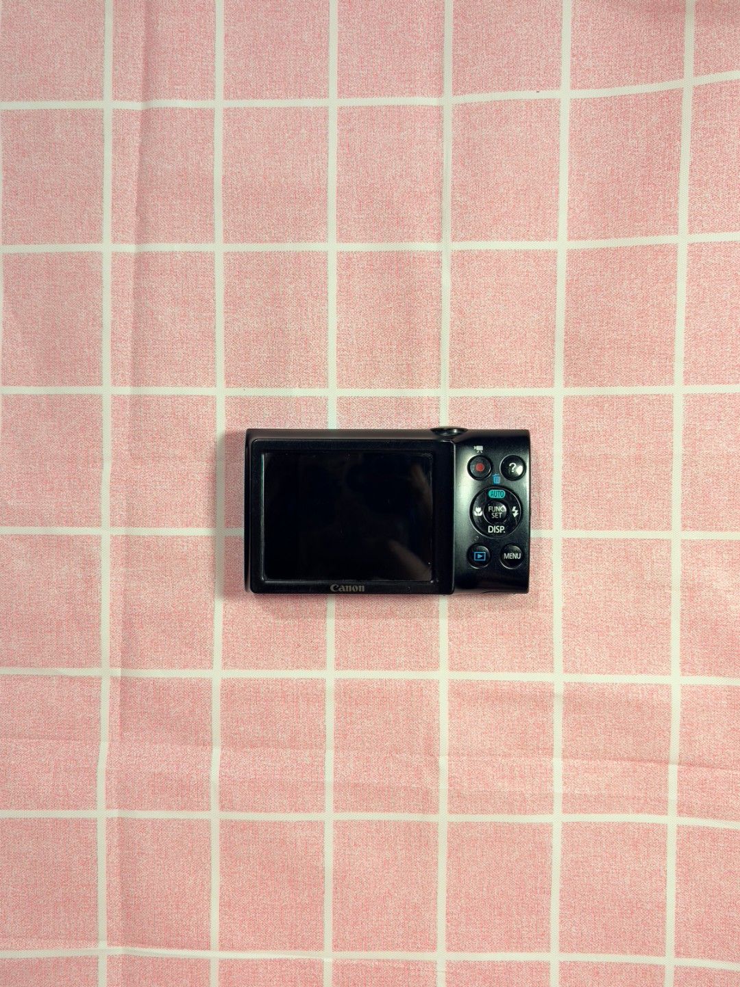 NEGOTIABLE Canon PowerShot A2300 (Category: Cameras) located in Agdangan. Submitted by nakim12 (Listing ID 1468176577, Image 3). Description: - Camera Model: Bright blue Canon digital camera - Resolution & Zoom: 16 megapixels with 5x optical zoom lens - Condition: Fully functional with test shots included; shows minor wear on body paint from regular use - Features: Compact pocket size, side battery/memory card door - Best For: Everyday snaps, str