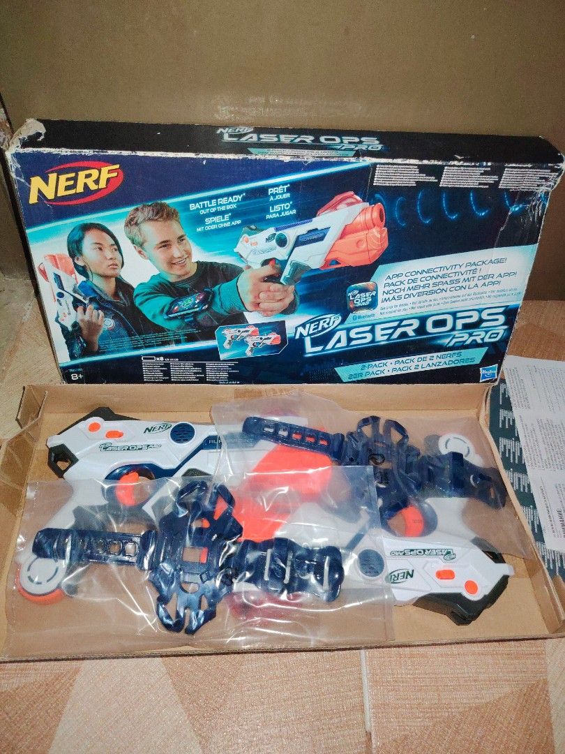 Nerf Laser Ops Pro AlphaPoint 2-Pack Blasters (Category: Action & Battle Toys) located in Santiago. Submitted by aceheart0118672 (Listing ID 1468148316, Image 1). Description: sealed contents but damaged box - Nerf Laser Ops Pro AlphaPoint two-pack set - Includes 2 laser blasters and 2 wrist mounts for smartphone app connectivity - Original box and packaging included - Ideal for backyard laser tag battles - Batteries not included.