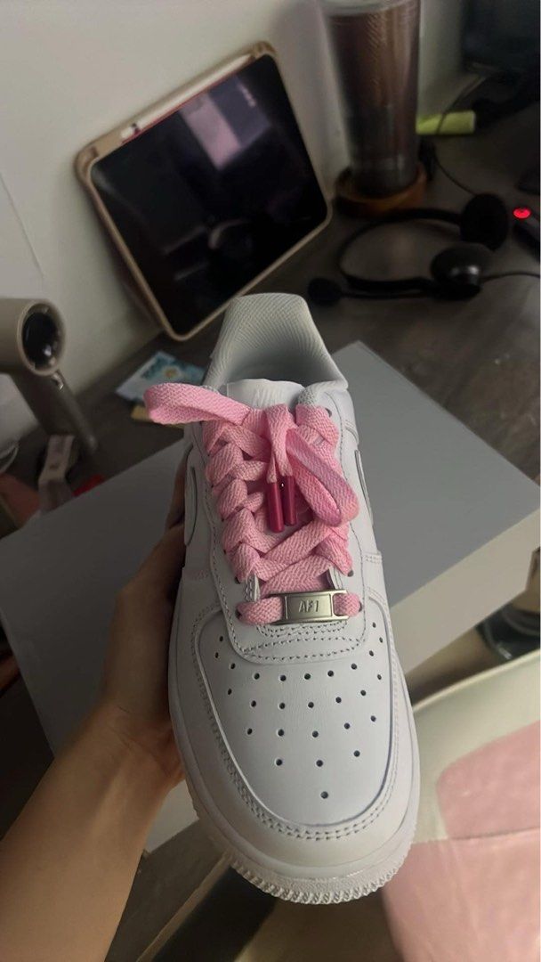 Nike Air Force 1 (Category: Sneakers) located in Manila. Submitted by eljrementilla (Listing ID 1468152586, Image 2). Description: - Model: Nike Air Force 1 (White) - Custom Details: bought and customized in NIKE BGC. 2 laces included. Pink and white (its laces before i had it customized) - Condition/Packaging: Comes with original grey Nike box - Versatility: Great daily rotation shoes with easy-to-swap laces.