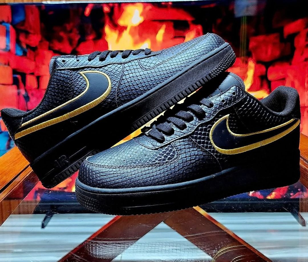 Nike Air Force 1 Custom Kobe Bryant Edition (Category: Sneakers) located in Caloocan City. Submitted by trevor_rabbit (Listing ID 1468230504, Image 1). Description: - Custom Nike Air Force 1 Kobe Bryant tribute sneakers - Black faux snakeskin upper with stylish gold accents - Includes alternate purple outsole and swoosh options - Embroidered '8' and '24' on the back heels - Pristine condition with zero scuffs on the soles - Must-have collectible 