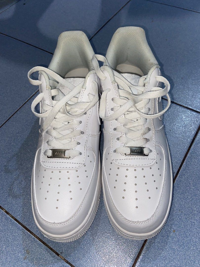 Nike Air Force 1 Low White Triple White (Category: Sneakers) located in Dumaguete. Submitted by riri_selling (Listing ID 1468229902, Image 1). Description: - Brand: Nike - Model: Air Force 1 Low (All-White) - Upper Material: Premium white leather with tonal stitching - Features: Perforated toe box, metal AF1 lace deubré, and chunky rubber sole with Air cushioning - Condition: Regular wear visible on the interior lining and soles - Style: Classic,