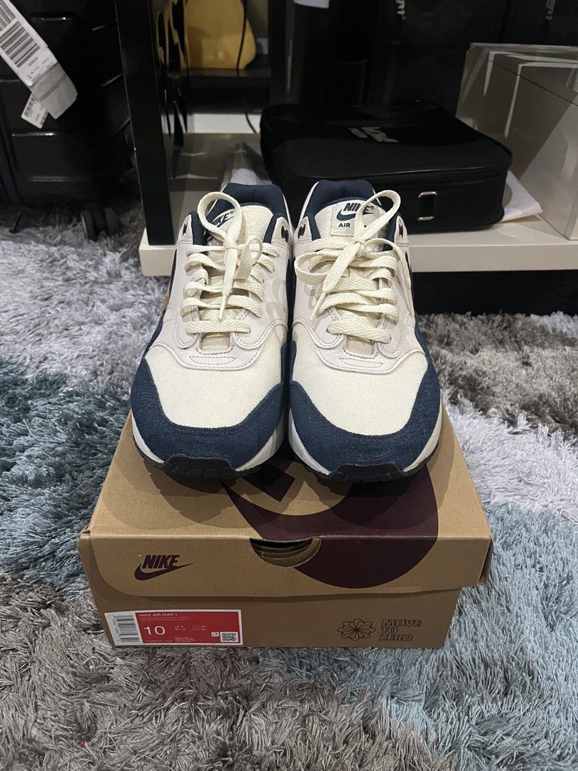 Nike Air Max 1 Coconut Milk Obsidian (Category: Casual Shoes) located in Manila. Submitted by jpnghua_08 (Listing ID 1468089740, Image 2). Description: - Model: Nike Air Max 1 - Colorway: Coconut Milk and Obsidian (Cream canvas/leather with dark navy accents) - Size: 10 US - Condition: Worn a few times - Inclusions: Original box included - Perfect daily wearer with a clean, versatile colorway.