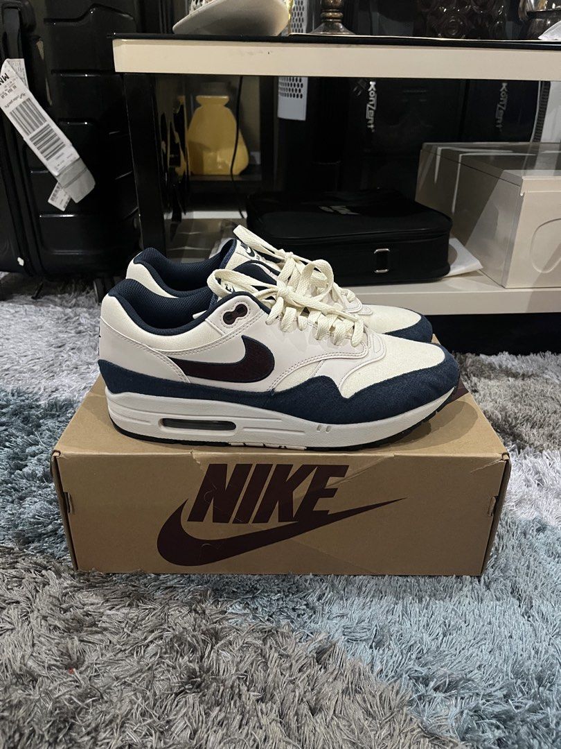 Nike Air Max 1 Coconut Milk Obsidian (Category: Casual Shoes) located in Manila. Submitted by jpnghua_08 (Listing ID 1468089740, Image 3). Description: - Model: Nike Air Max 1 - Colorway: Coconut Milk and Obsidian (Cream canvas/leather with dark navy accents) - Size: 10 US - Condition: Worn a few times - Inclusions: Original box included - Perfect daily wearer with a clean, versatile colorway.