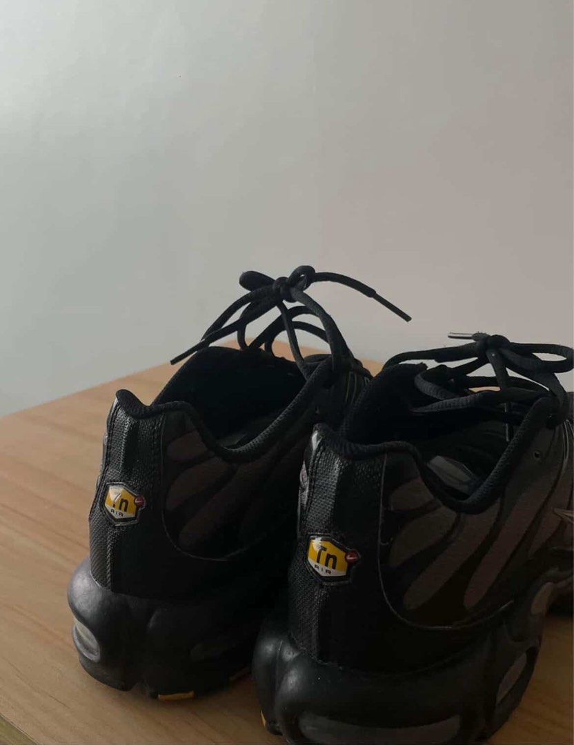 Nike Air Max Plus (TN / Tuned Air) (Category: Sneakers) located in Manila. Submitted by lebiii (Listing ID 1468196927, Image 1). Description: Authentic Nike Air Max Plus (TN) in a sleek Black/Dark Grey colorway featuring classic Tn heel logos. In pre-owned condition with air units intact and ready for daily wear. DM for inquiries, shipping, or offers!.