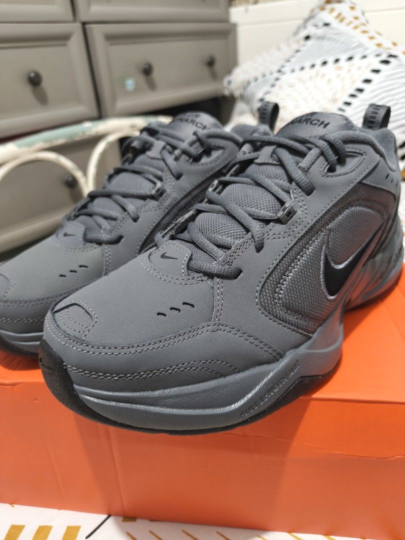 Nike Air Monarch IV Dark Grey Black (Category: Sneakers) located in Taguig. Submitted by akyliscloset (Listing ID 1468091880, Image 2). Description: - Brand: Nike Air Monarch IV - Colorway: Dark Grey and Black - Condition: Brand new in original orange box - Size: Men's US 10 / UK 9 / EUR 44 - Style: Chunky dad shoe with visible stitching, perforated details, and heel pull tab - Perfect reliable trainers for daily casual wear.