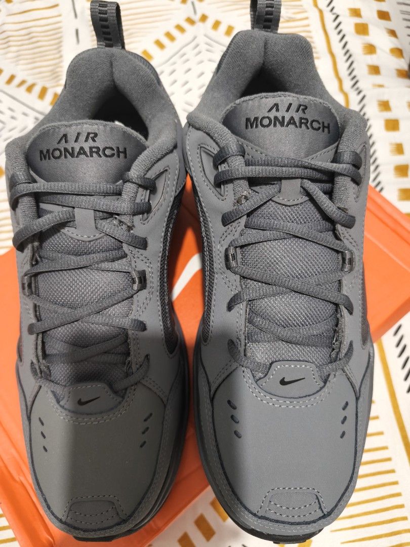 Nike Air Monarch IV Dark Grey Black (Category: Sneakers) located in Taguig. Submitted by akyliscloset (Listing ID 1468091880, Image 3). Description: - Brand: Nike Air Monarch IV - Colorway: Dark Grey and Black - Condition: Brand new in original orange box - Size: Men's US 10 / UK 9 / EUR 44 - Style: Chunky dad shoe with visible stitching, perforated details, and heel pull tab - Perfect reliable trainers for daily casual wear.