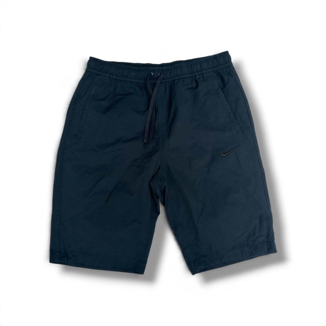 Nike Black Athletic Shorts with Drawstring (Category: Shorts) located in Pantukan. Submitted by modhexx (Listing ID 1468081738, Image 1). Description: - Brand: Nike - Color: Classic Black - Fit & Comfort: Adjustable drawstring waistband with lightweight fabric - Practicality: Equipped with convenient side pockets - Branding: Small embroidered Nike swoosh logo on the lower left hem - Condition: Clean overall appearance, no noticeable wear - Ideal 