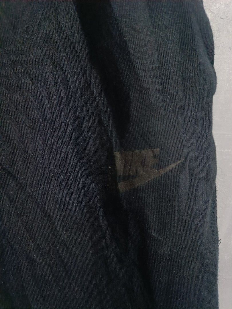 Nike Black Shorts CW4293-010 Size M (Category: Shorts) located in Iloilo. Submitted by wendxcz-thrift- (Listing ID 1468196282, Image 2). Description: - Brand: Nike - Color: Black - Size: Medium - Style Code: CW4293-010 - Material: Comfortable fleece inside - Waistband: Elastic with adjustable drawstring cords - Pockets: Regular side pockets + extra vertical zippered pocket on the right leg - Branding: Subtle Nike logo on lower left leg - Conditio