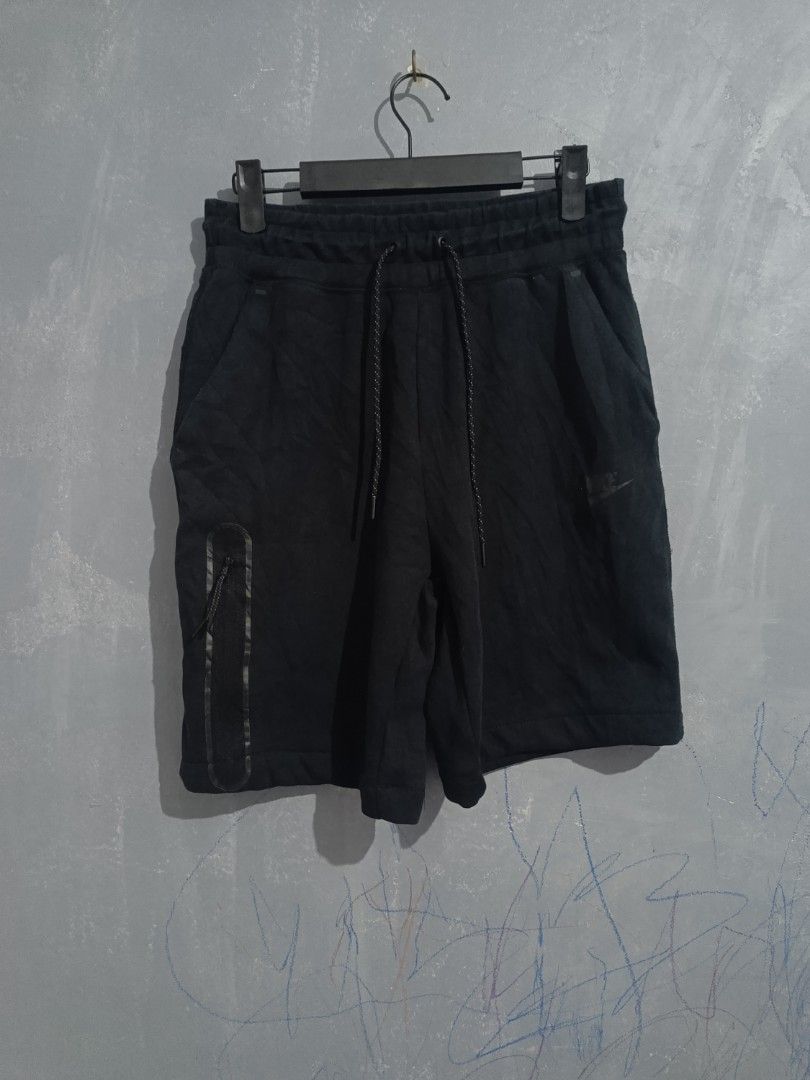 Nike Black Shorts CW4293-010 Size M (Category: Shorts) located in Iloilo. Submitted by wendxcz-thrift- (Listing ID 1468196282, Image 1). Description: - Brand: Nike - Color: Black - Size: Medium - Style Code: CW4293-010 - Material: Comfortable fleece inside - Waistband: Elastic with adjustable drawstring cords - Pockets: Regular side pockets + extra vertical zippered pocket on the right leg - Branding: Subtle Nike logo on lower left leg - Conditio