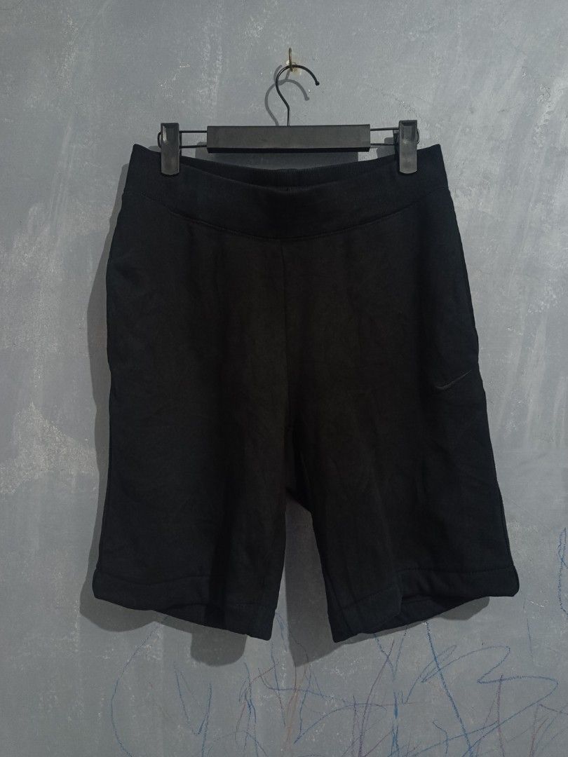 Nike Black Sweatshorts Size M (Category: Shorts) located in Iloilo. Submitted by wendxcz-thrift- (Listing ID 1468195901, Image 1). Description: - Brand/Item: Black Nike sweatshorts - Size: Medium (M) - Details: Embroidered Nike logo near the hem, back pocket with button closure, thick ribbed waistband - Condition: Good everyday casual wear, but please note there is a small tear on the inner waistband (as shown in photos) - Shipping & Meetups: Fas