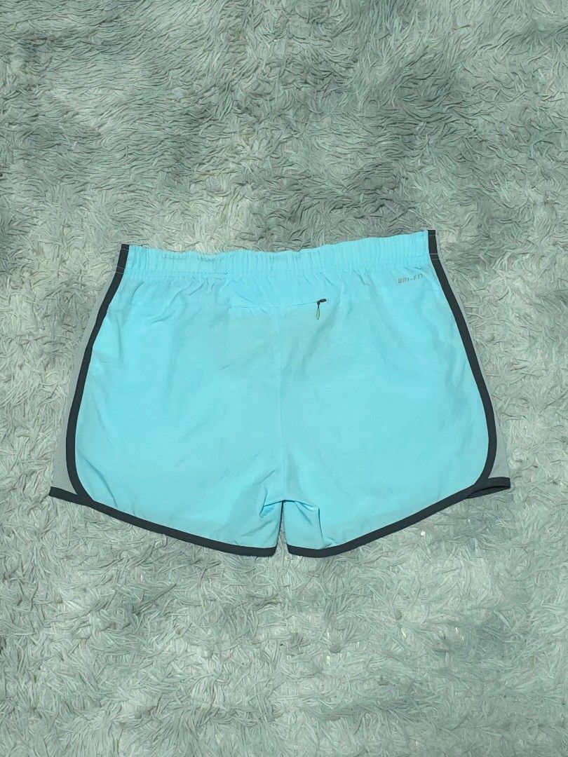 Nike Dri-FIT Running Shorts Light Blue Grey (Category: Shorts) located in Abulug. Submitted by humanwhosellthings (Listing ID 1468189779, Image 2). Description: - Authentic Nike Dri-FIT running shorts in light blue ✅Excellent Condition ✅Issue: none ▫️Waist Size: 30-36 ▫️Length: 12 - Breathable grey mesh side panels and stylish black piping - Comfortable elastic waistband with Nike Running adjustable drawstring - Convenient small back zippered poc