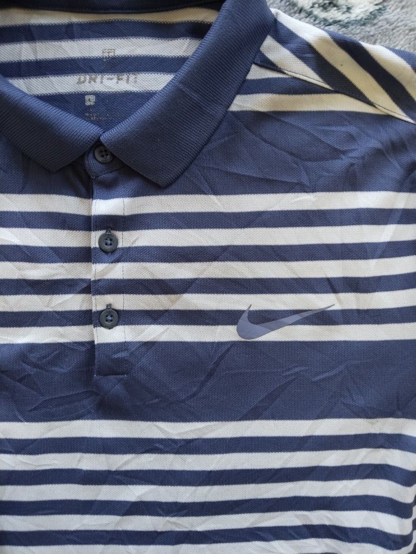 Nike Dri-FIT Striped Performance Polo — Size L (Category: Tshirts & Polo Shirts ) located in Mabalacat. Submitted by al_amin_thrift (Listing ID 1468121296, Image 2). Description: Nike Dri-FIT Striped Performance Polo — Size L ✅ 100% Authentic Nike — Style #887493-498 ✅ Size L — regular fit ✅ Navy blue & white stripes — classic versatile design ✅ Dri-FIT tech — moisture-wicking, quick-dry, keeps you cool ✅ Lightweight & smooth — great for golf, ca