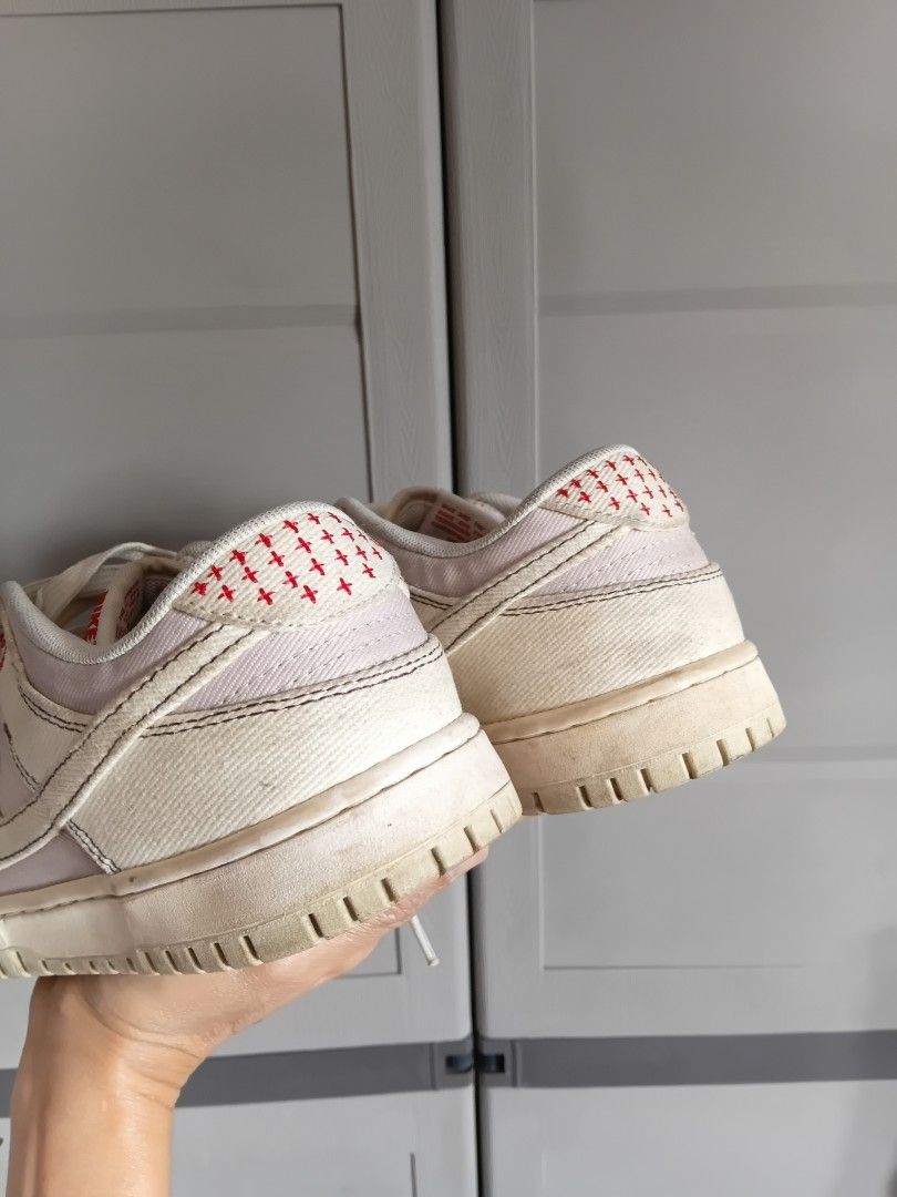 Nike Dunk Low Sail Red Stitching Sneakers (Category: Sneakers) located in Manila. Submitted by grandflower-547aee (Listing ID 1468067335, Image 3). Description: - Brand/Model: Nike Dunk Low - Colorway: Cream/Sail canvas with striking red cross-stitching on the toe box and heel - Details: White laces, matching rubber midsole/outsole, and red Nike tongue tag - Condition: Pre-owned with visible dirt, scuffs, and tread wear - Perfect for daily wear o