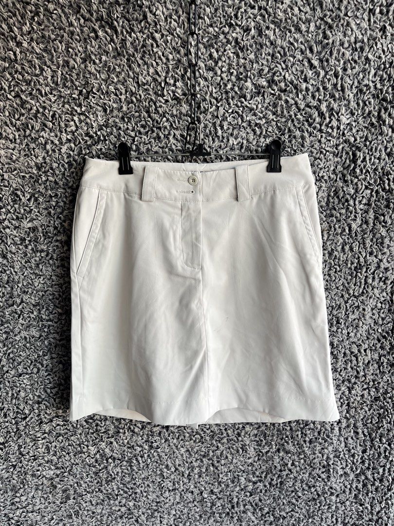 Nike Golf Dri-FIT Tour Performance Skort | Size S (Category: Skirts) located in General Trias. Submitted by zrchustle.604 (Listing ID 1468221861, Image 2). Description: Nike Golf Dri-FIT Tour Performance Skort in a light tan / beige colorway. Product Overview • Type: Women's Golf Skort (an athletic skirt with built-in hidden shorts underneath). • Key Features: Features a structured waistband with belt loops, two back welt pockets, a center seam d