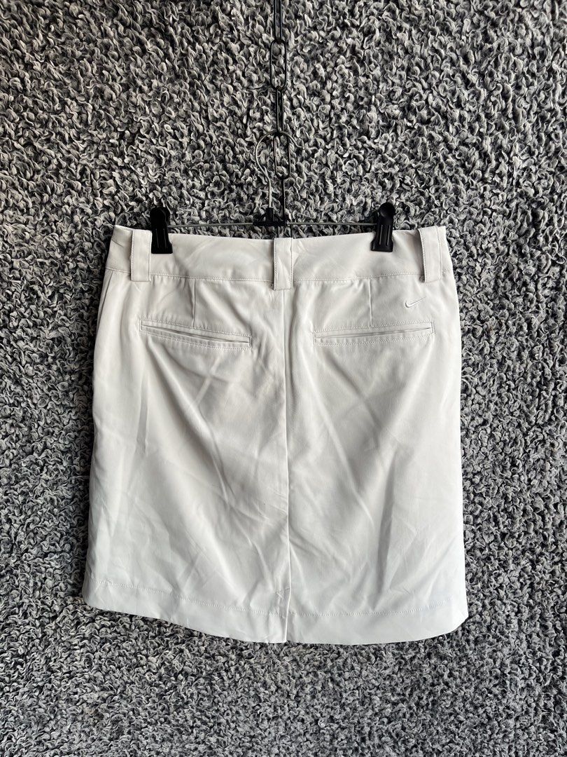 Nike Golf Dri-FIT Tour Performance Skort | Size S (Category: Skirts) located in General Trias. Submitted by zrchustle.604 (Listing ID 1468221861, Image 1). Description: Nike Golf Dri-FIT Tour Performance Skort in a light tan / beige colorway. Product Overview • Type: Women's Golf Skort (an athletic skirt with built-in hidden shorts underneath). • Key Features: Features a structured waistband with belt loops, two back welt pockets, a center seam d
