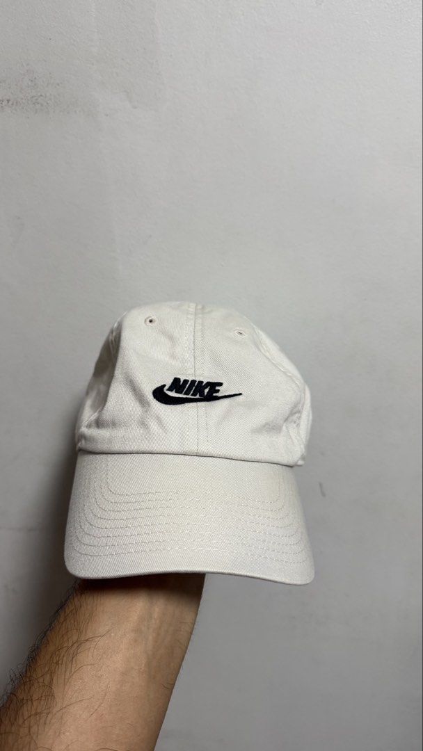 Nike Heritage 86 Off-White Cap (Category: Caps & Hats) located in Quezon City. Submitted by kobeeeee_12 (Listing ID 1468146860, Image 1). Description: - Brand: Nike Heritage 86 - Color: Off-white with black embroidered logo - Material: 100% cotton body (polyester blend lining) - Fit: Adjustable strapback with silver metal buckle, One Size - Style: Classic everyday dad hat.