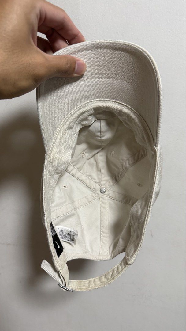 Nike Heritage 86 Off-White Cap (Category: Caps & Hats) located in Quezon City. Submitted by kobeeeee_12 (Listing ID 1468146860, Image 2). Description: - Brand: Nike Heritage 86 - Color: Off-white with black embroidered logo - Material: 100% cotton body (polyester blend lining) - Fit: Adjustable strapback with silver metal buckle, One Size - Style: Classic everyday dad hat.