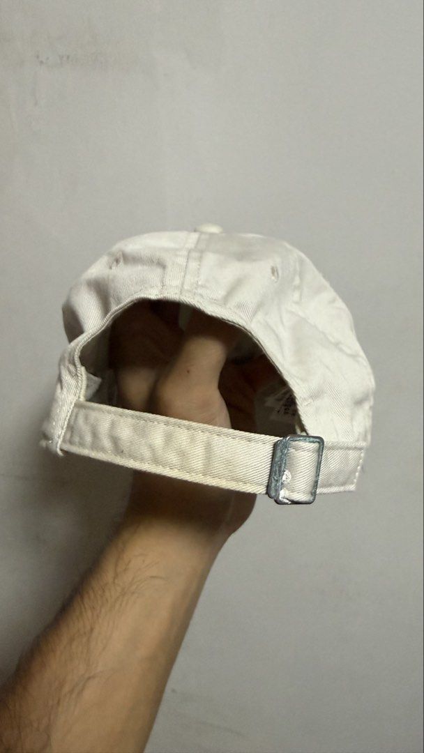 Nike Heritage 86 Off-White Cap (Category: Caps & Hats) located in Quezon City. Submitted by kobeeeee_12 (Listing ID 1468146860, Image 3). Description: - Brand: Nike Heritage 86 - Color: Off-white with black embroidered logo - Material: 100% cotton body (polyester blend lining) - Fit: Adjustable strapback with silver metal buckle, One Size - Style: Classic everyday dad hat.