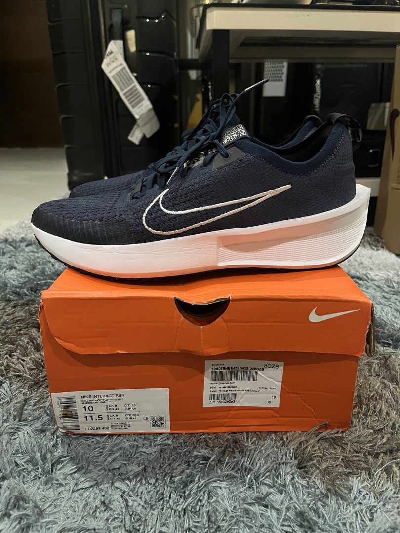 Nike Interact Run College Navy Platinum Tint Size 10 (Category: Sneakers) located in Manila. Submitted by jpnghua_08 (Listing ID 1468094982, Image 1). Description: - Model: Nike Interact Run - Colorway: College Navy / Platinum Tint - Size: Men's US 10 / Women's US 11.5 - Design: Dark blue knitted upper with white embroidered Swoosh and chunky white midsole - Inclusions: Original orange Nike shoebox included.