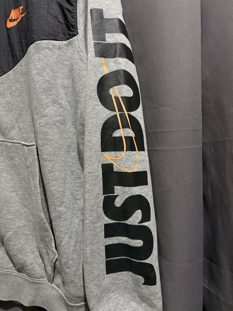 Nike Just Do It Full Zip Hoodie (Category: Hoodies) located in Santo Tomas. Submitted by miguelhussle (Listing ID 1468059646, Image 2). Description: - Brand: Nike -26 L x 23 W - Style: Full zip hoodie with drawstring - Color: Grey and black with contrasting nylon upper chest panel - Features: Front kangaroo pockets, ribbed cuffs and hem - Size: Large - Condition: Excellent - Made in: China.