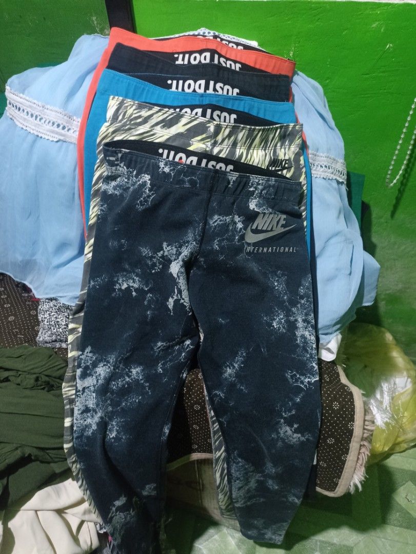 Nike Leggings Bundle Multi-colour Just Do It (Category: Activewear) located in Tarlac. Submitted by allinoneshop2178 (Listing ID 1468073630, Image 1). Description: - Brand: Nike - Item: Bundle of leggings (Black, blue, red, and patterned) - Size: Small (S) on tag Keri up to meduim - Features: Elastic waistband with 'Just Do It' lettering, soft stretch material - Condition: Great for workouts or casual daily wear - Selling as: Bundle pack only(10p