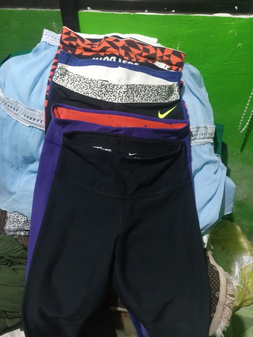 Nike Leggings Bundle Multi-colour Just Do It (Category: Activewear) located in Tarlac. Submitted by allinoneshop2178 (Listing ID 1468073630, Image 2). Description: - Brand: Nike - Item: Bundle of leggings (Black, blue, red, and patterned) - Size: Small (S) on tag Keri up to meduim - Features: Elastic waistband with 'Just Do It' lettering, soft stretch material - Condition: Great for workouts or casual daily wear - Selling as: Bundle pack only(10p