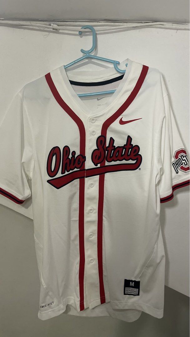 Nike Ohio State Buckeyes Baseball Jersey White Size M (Category: Activewear) located in Cavite. Submitted by tristanmunar (Listing ID 1468167950, Image 1). Description: - Authentic Nike Ohio State Buckeyes baseball jersey - Color: White with red piping and script lettering - Size: Medium (Fit to Large) - Technology: Nike Dri-Fit for moisture management - Details: Ohio State patch on left sleeve, embroidered Swoosh logo on upper right chest - Clos