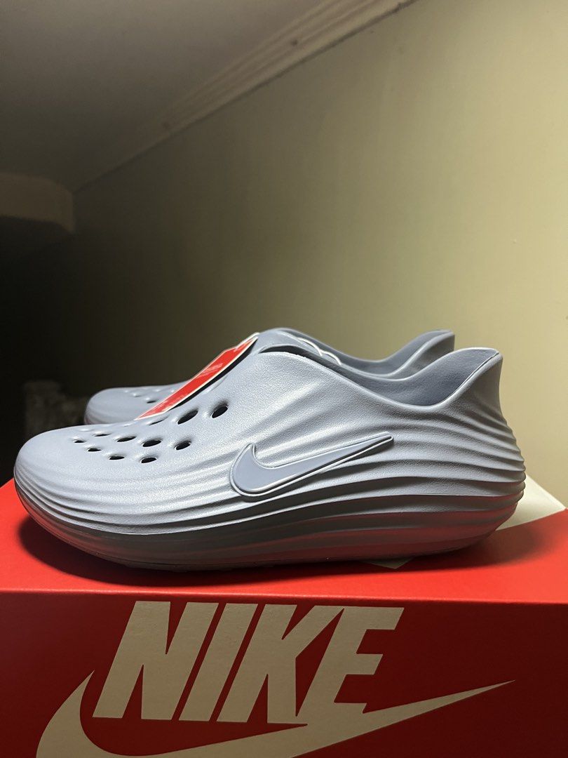 Nike ReactX Rejuven8 GS Ashen Slate (Category: Sneakers) located in Valenzuela. Submitted by rr.sneakerstash (Listing ID 1468192806, Image 2). Description: - Brand: Nike - Model: ReactX Rejuven8 - Colorway: Ashen Slate - Size: Youth 7Y - Condition: Brand new, unworn, straight out of the box - Design: Slip-on recovery shoe with all-over ventilation holes and side swoosh branding - Midsole: Stylish ribbed wave texture for extra comfort - Inclusions