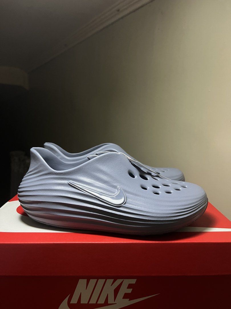Nike ReactX Rejuven8 GS Ashen Slate (Category: Sneakers) located in Valenzuela. Submitted by rr.sneakerstash (Listing ID 1468192806, Image 1). Description: - Brand: Nike - Model: ReactX Rejuven8 - Colorway: Ashen Slate - Size: Youth 7Y - Condition: Brand new, unworn, straight out of the box - Design: Slip-on recovery shoe with all-over ventilation holes and side swoosh branding - Midsole: Stylish ribbed wave texture for extra comfort - Inclusions