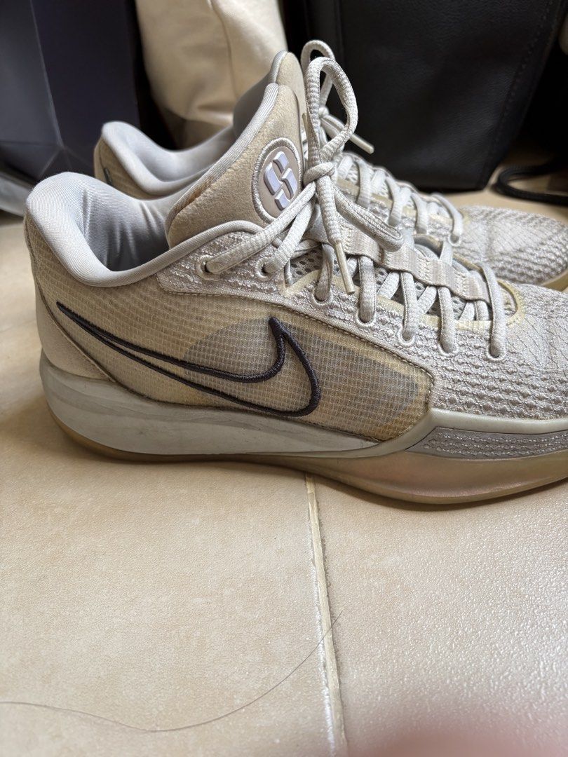 Nike Sabrina 1 US Size 9 (Category: Sneakers) located in Manila. Submitted by loislane112233 (Listing ID 1468074827, Image 3). Description: - Brand: Nike - Model: Sabrina 1 / FQ3389-010 - Color: Oatmeal - Size: US 9 / UK 6.5 / EUR 40.5 / 26 cm - Upper: Breathable textured mesh with signature tongue logo - Sole: Cushioned midsole with durable gum rubber outsole for excellent traction - Condition: Minor signs of wear on mesh and midsole, overall gr