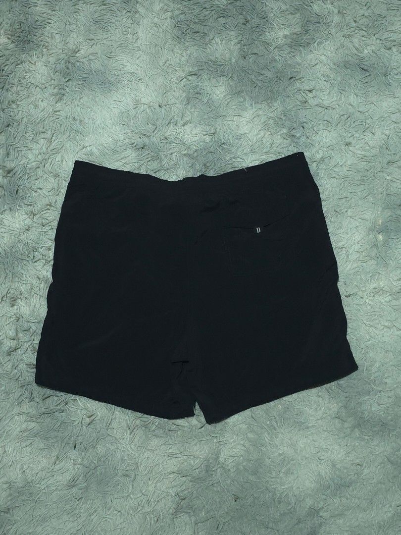 Nike Sportswear Black Shorts (Category: Shorts) located in Abulug. Submitted by humanwhosellthings (Listing ID 1468184320, Image 2). Description: - Brand: Nike Sportswear ✅Excellent Condition ✅Issue: none ▫️Waist Size: 36-40 ▫️Length: 17 - Color: Black with white, green, and grey colorblock panel - Details: White Nike logo near hem, elastic waistband with patterned drawstring - Pockets: Includes a back pocket with button closure and striped tab.