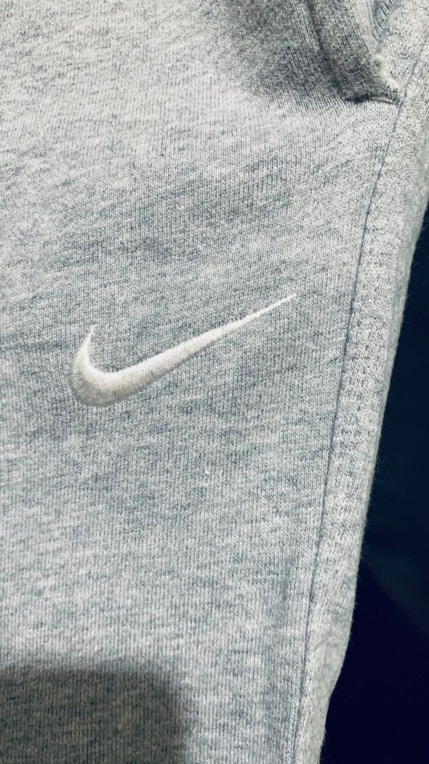 Nike Sweat Pants (Light Grey) (Category: Joggers) located in Taguig. Submitted by reused.unused (Listing ID 1468196006, Image 2). Description: Nike Sweat Pants (Light Grey) Embroidered Swoosh (White) L on Tag 38in to 40in width (waist) 42.5in length (waist to hem) 9in width (zippered leg opening) Issue/s: signs of usage -refer to photos for actual condition -refer to close up photo for actual color -pre-loved item so signs of usage is expected -f