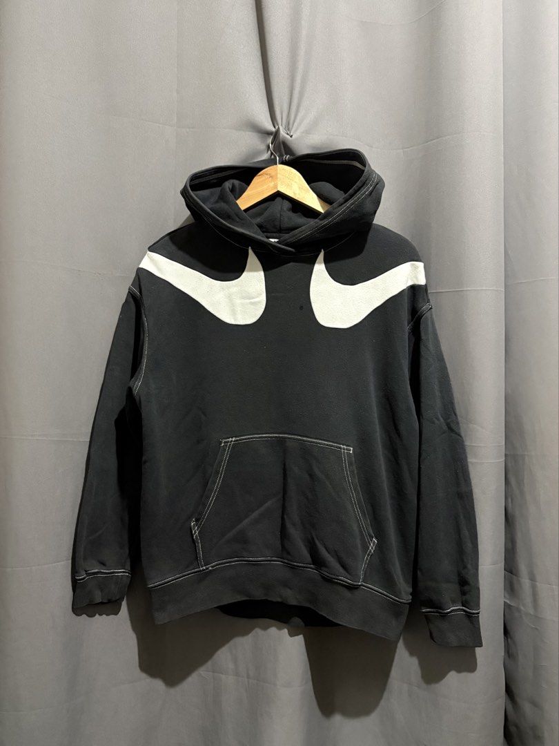 Nike Swoosh Double Swoosh Black (Category: Hoodies) located in Santo Tomas. Submitted by miguelhussle (Listing ID 1468059763, Image 1). Description: - Authentic Nike Black Hoodie (Model DD5581-010) - Size: Small -25 L x 22 W -9/10 Condition - Made in Cambodia - Oversized white swoosh logos on front shoulders - Contrasting white stitching details throughout - Classic kangaroo pocket - Ribbed cuffs and hem - Warm fleece material, perfect streetwear