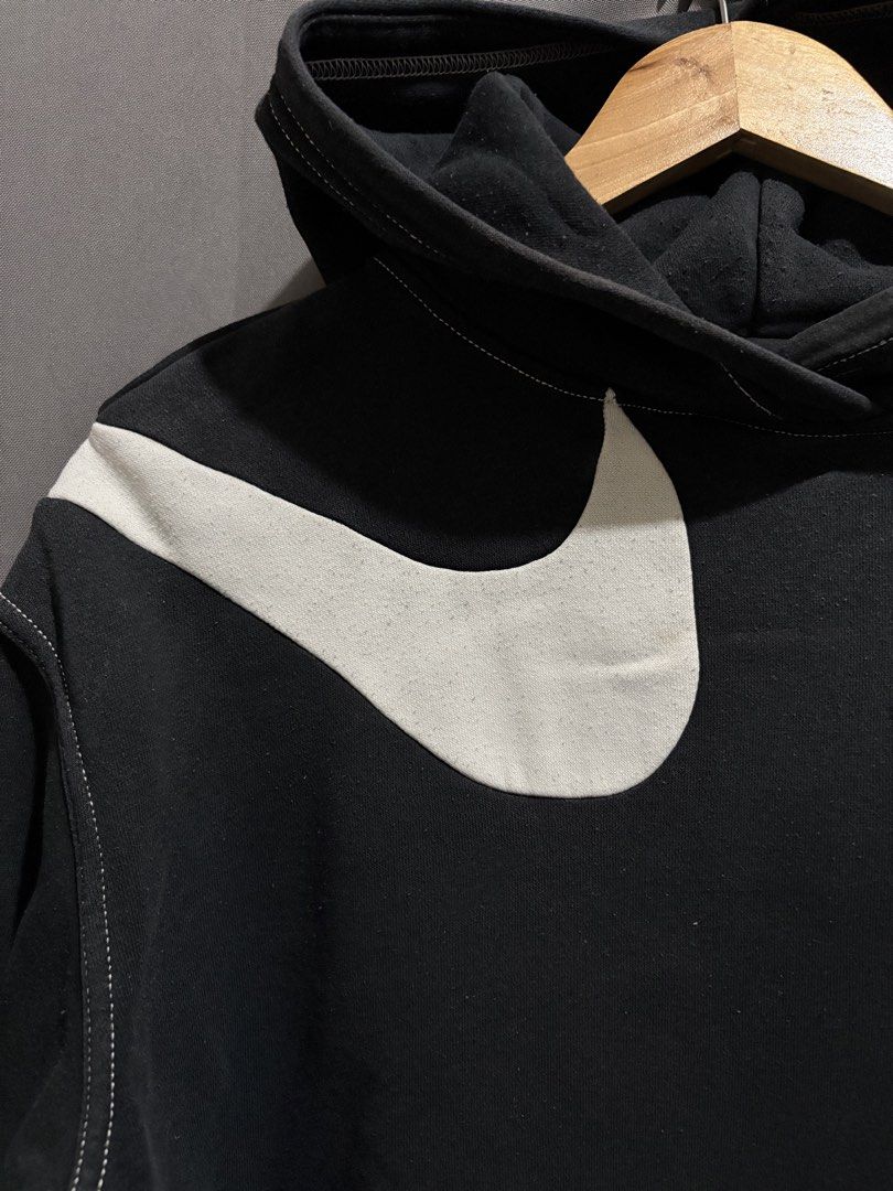 Nike Swoosh Double Swoosh Black (Category: Hoodies) located in Santo Tomas. Submitted by miguelhussle (Listing ID 1468059763, Image 3). Description: - Authentic Nike Black Hoodie (Model DD5581-010) - Size: Small -25 L x 22 W -9/10 Condition - Made in Cambodia - Oversized white swoosh logos on front shoulders - Contrasting white stitching details throughout - Classic kangaroo pocket - Ribbed cuffs and hem - Warm fleece material, perfect streetwear