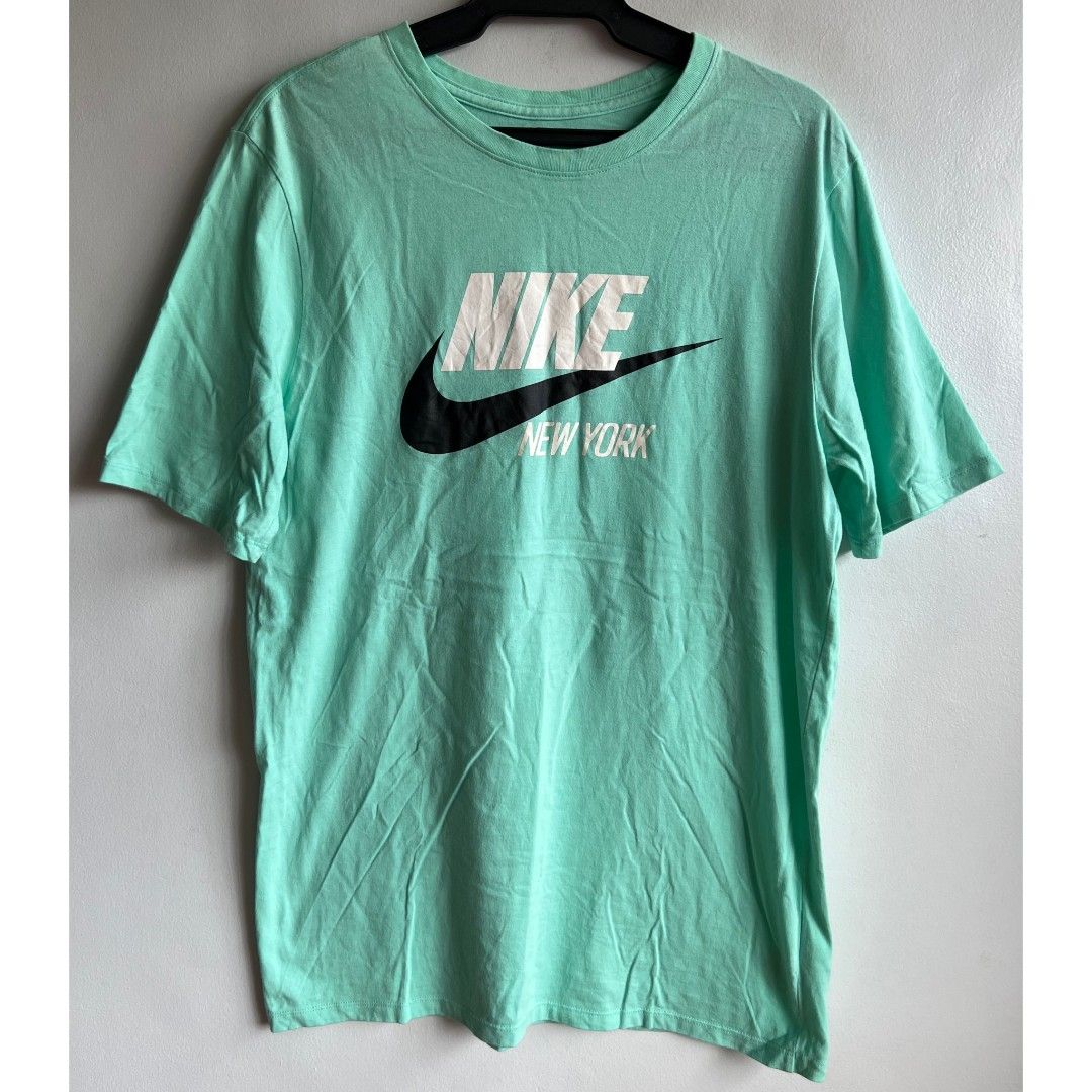 Nike T Shirt top men's (Category: Tshirts & Polo Shirts ) located in Quezon City. Submitted by rosepam (Listing ID 1468201560, Image 2). Description: Nike NYC Tee Shirt Size on tag: M FIX PRICE Measurements posted for reference.
