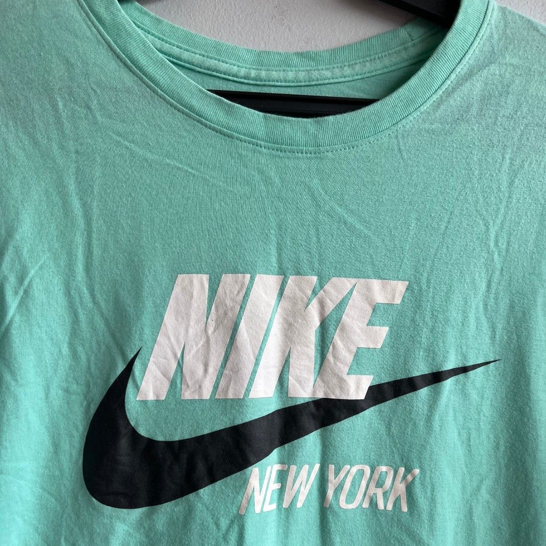 Nike T Shirt top men's (Category: Tshirts & Polo Shirts ) located in Quezon City. Submitted by rosepam (Listing ID 1468201560, Image 3). Description: Nike NYC Tee Shirt Size on tag: M FIX PRICE Measurements posted for reference.