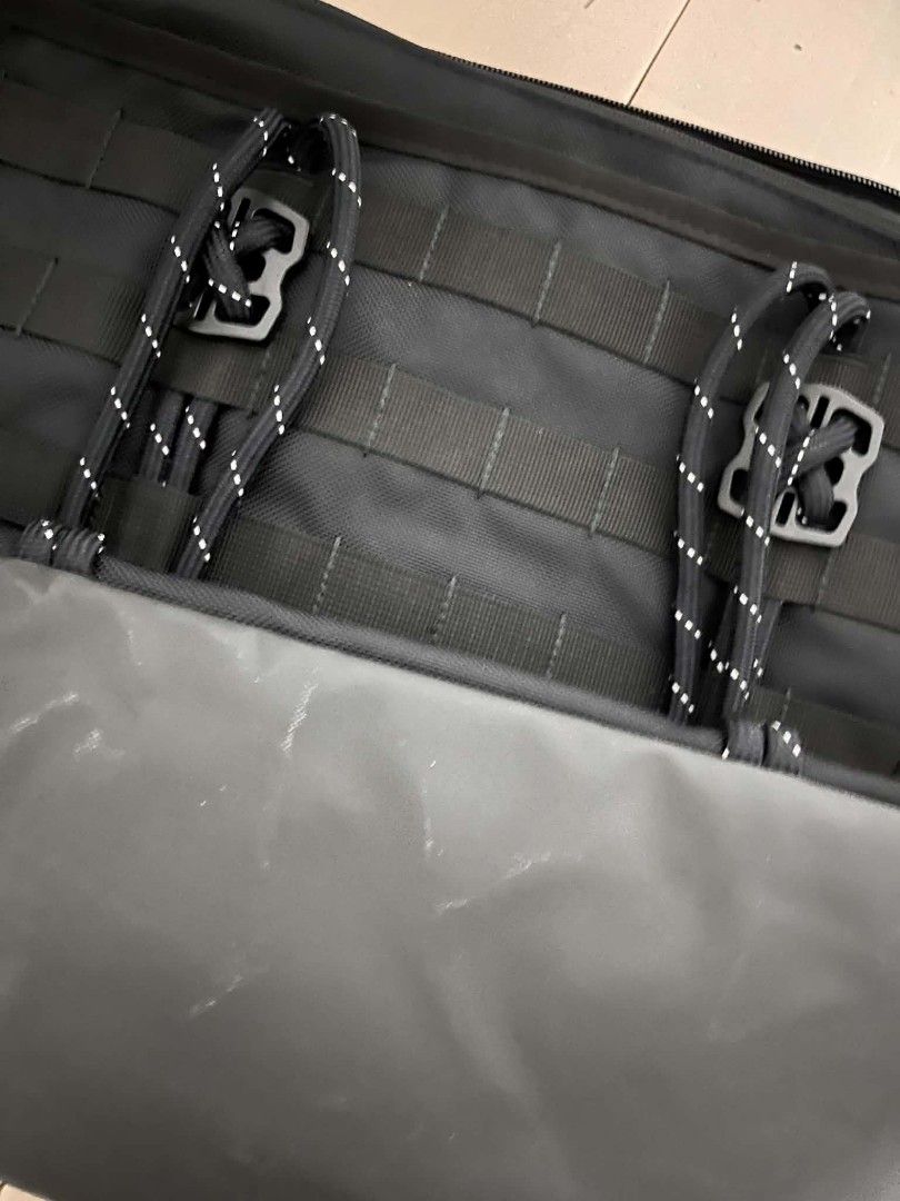 Nike Utility Tote Bag Black (Category: Tote Bags) located in Caloocan City. Submitted by savastrid (Listing ID 1468119411, Image 3). Description: - Color: All Black - Material: Heavy-duty and durable construction - Design: Modern look with exterior tactical straps, loops, and a white embroidered Nike swoosh - Straps: Sturdy dual shoulder straps accented with reflective threading - Storage: Spacious interior ideal for daily essentials, gym clothes