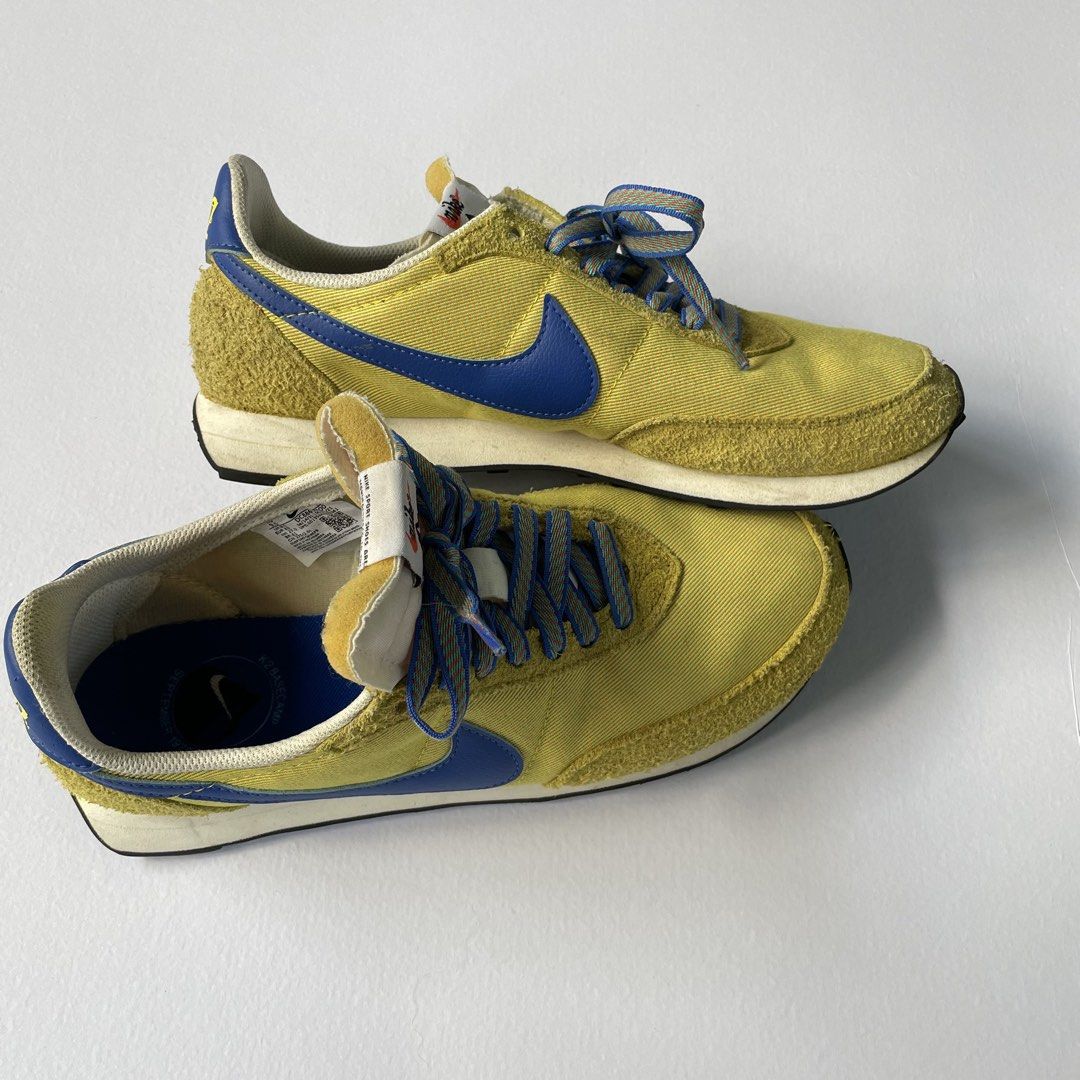 Nike Waffle Trainer 2 SD (Category: Sneakers) located in Manila. Submitted by sydge_ (Listing ID 1468136196, Image 2). Description: - Style: Retro runner, perfect for daily rotation - Colorway: Striking yellow and blue with blue and orange patterned laces - Materials: Textured suede overlays mixed with breathable fabric - Details: Iconic blue swoosh, NIK2 branding at the heel, and special text markings on blue insoles - Size: US 9.5.
