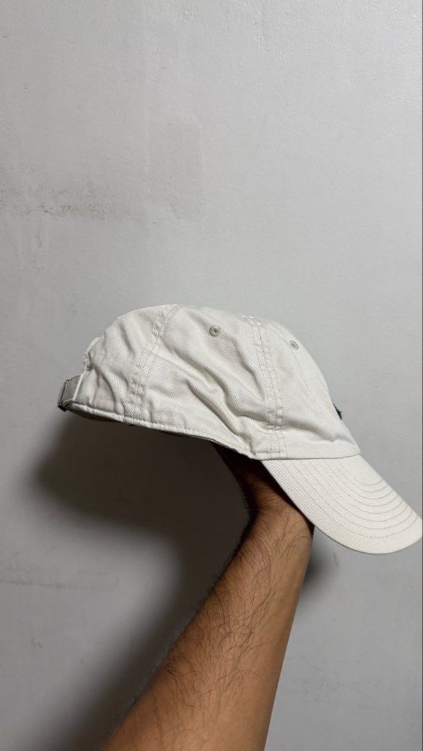 Nike White Baseball Cap (Category: Caps & Hats) located in Quezon City. Submitted by kobeeeee_12 (Listing ID 1468146989, Image 3). Description: - Color: White with classic black embroidered swoosh - Material: 100% comfortable cotton twill - Fit: Adjustable strap with metal slider and small swoosh tag detail - Style: Clean, minimalist look that pairs easily with any casual outfit .
