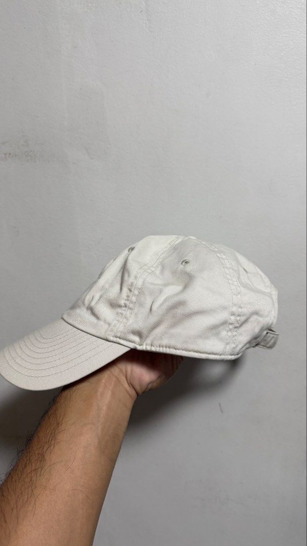 Nike White Baseball Cap (Category: Caps & Hats) located in Quezon City. Submitted by kobeeeee_12 (Listing ID 1468146989, Image 2). Description: - Color: White with classic black embroidered swoosh - Material: 100% comfortable cotton twill - Fit: Adjustable strap with metal slider and small swoosh tag detail - Style: Clean, minimalist look that pairs easily with any casual outfit .
