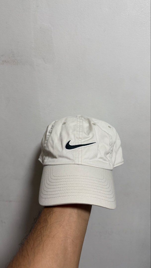 Nike White Baseball Cap (Category: Caps & Hats) located in Quezon City. Submitted by kobeeeee_12 (Listing ID 1468146989, Image 1). Description: - Color: White with classic black embroidered swoosh - Material: 100% comfortable cotton twill - Fit: Adjustable strap with metal slider and small swoosh tag detail - Style: Clean, minimalist look that pairs easily with any casual outfit .
