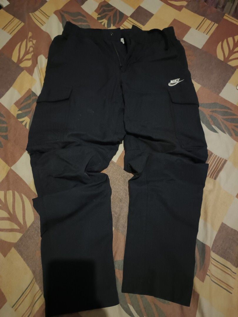 Nike woven cargo pants (Category: Jeans) located in Odiongan. Submitted by thriftngo26 (Listing ID 1468199273, Image 1). Description: These appear to be black Nike men's woven cargo pants, such as the Nike Sportswear Club Men's Woven Cargo.