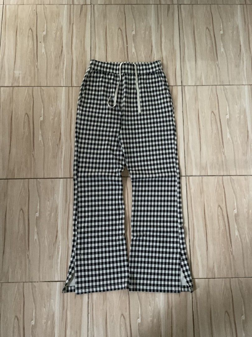 niko and... plaid bootcut flared pajamas (Category: Trousers) located in Manila. Submitted by sampeso (Listing ID 1468238344, Image 1). Description: - Brand: Niko and... - Style: Gingham trousers / wide leg - Color: Black and white check pattern - Size: waist: 26-30 inches length: 38 inches leg opening: 11 inches - Fit: Relaxed fit with adjustable drawstring waistband - Condition: Great staple piece, super comfy and easy to match .