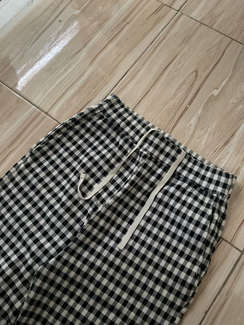 niko and... plaid bootcut flared pajamas (Category: Trousers) located in Manila. Submitted by sampeso (Listing ID 1468238344, Image 3). Description: - Brand: Niko and... - Style: Gingham trousers / wide leg - Color: Black and white check pattern - Size: waist: 26-30 inches length: 38 inches leg opening: 11 inches - Fit: Relaxed fit with adjustable drawstring waistband - Condition: Great staple piece, super comfy and easy to match .