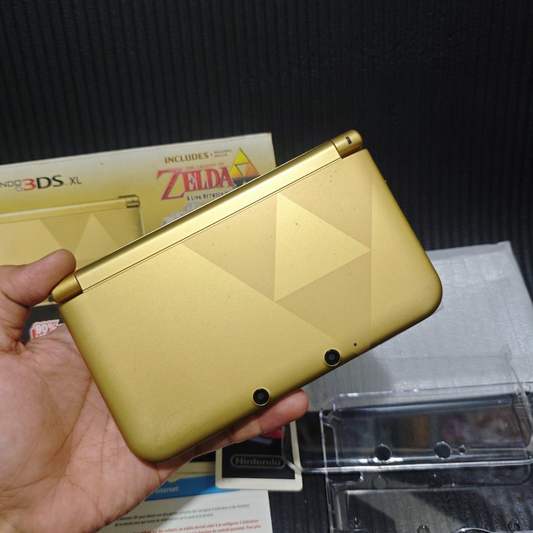 Nintendo 3DS XL Zelda Edition with Box (Category: Nintendo) located in Quezon City. Submitted by shopme_gadget30 (Listing ID 1468240735, Image 3). Description: kindly read the details 8/10 Good Condition no issue no dent excellent performance with minimal scratches only but not noticeable with paint chip and discoloration also with screen protector on lower screen only NO scratches on the screen Serial number matched with the box and unit latest 