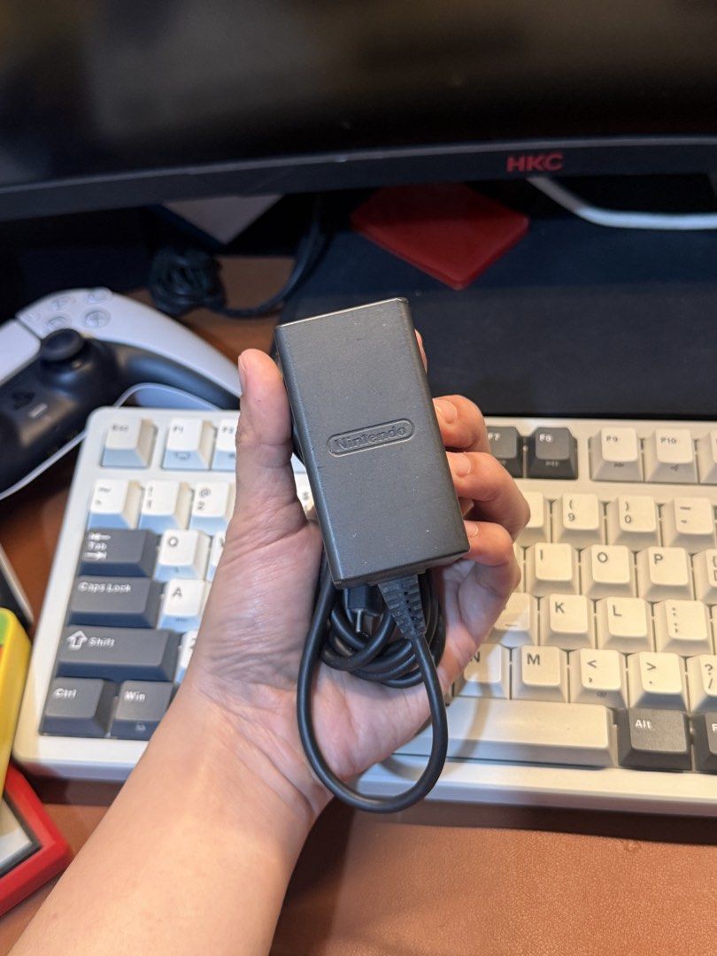 Nintendo Switch AC Adapter Power Charger (Category: Cables & Chargers) located in Antipolo. Submitted by saiisare19 (Listing ID 1468228397, Image 1). Description: - 100% Original Nintendo Switch AC Adapter (Model: HAC-002 USA) - Powers and charges your console without any issues - Standard two-prong plug with attached USB-C cable - Shows normal wear on the plastic housing from everyday use - Ready to use, just plug and play.