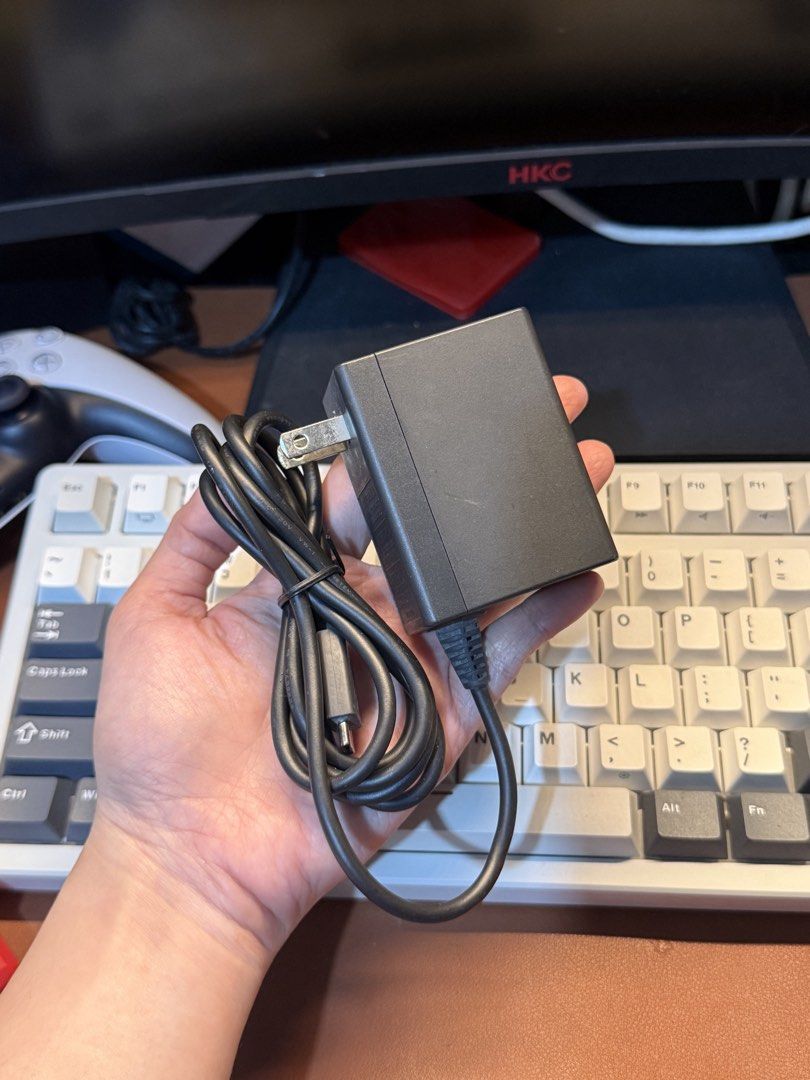 Nintendo Switch AC Adapter Power Charger (Category: Cables & Chargers) located in Antipolo. Submitted by saiisare19 (Listing ID 1468228397, Image 3). Description: - 100% Original Nintendo Switch AC Adapter (Model: HAC-002 USA) - Powers and charges your console without any issues - Standard two-prong plug with attached USB-C cable - Shows normal wear on the plastic housing from everyday use - Ready to use, just plug and play.