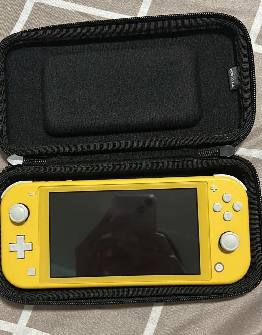 Nintendo Switch Lite Yellow with Hori Case (Category: Nintendo) located in Cavite. Submitted by mrswitchfoot (Listing ID 1468281557, Image 1). Description: - Item: Yellow Nintendo Switch Lite handheld console - Condition: Excellent, clean screen with zero visible scratches - Controls: Buttons and joysticks are fully intact and clean - Inclusion: Comes with a sturdy black Hori carrying case - Perfect for portable gaming anytime, anywhere Slight ne