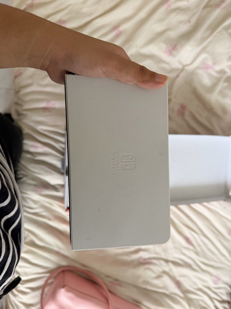 Nintendo Switch OLED Model White WITH Tomodachi Life (Category: Nintendo) located in Quezon City. Submitted by catmumcertiflied (Listing ID 1468144627, Image 3). Description: - Model: Nintendo Switch OLED System (White) - Included: Console, white Joy-Con controllers, white dock, and original box - Display: Vibrant 7-inch OLED screen - Condition: NO ISSUES! like brand new, packs neatly into original packaging - With Tomodachi Life Game - Meetup or