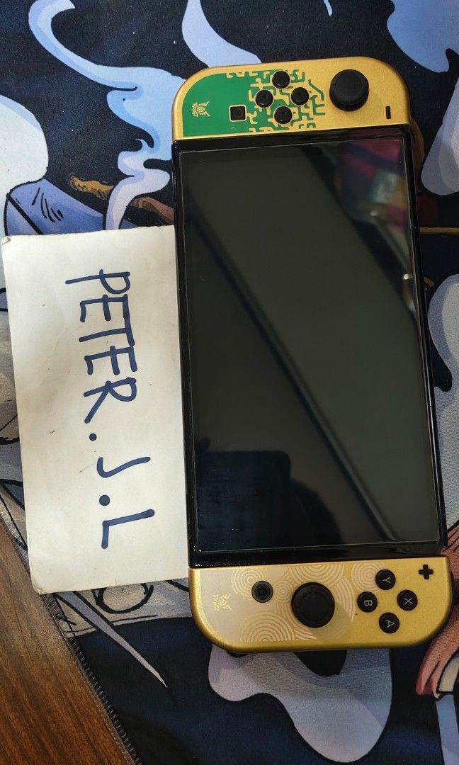 Nintendo switch oled zelda edition (Category: Nintendo) located in Agdangan. Submitted by pjlim06 (Listing ID 1468064271, Image 2). Description: For sale only Nintendo switch oled zelda edition With tempered glass (installed) With original zelda edition dock With original charger With zelda edition joycon strap With hdmi With pouch 128gb external + 64gb internal With nba 2k24 (physical cart) Note: may small crack sa left joycon...maliit lang siya